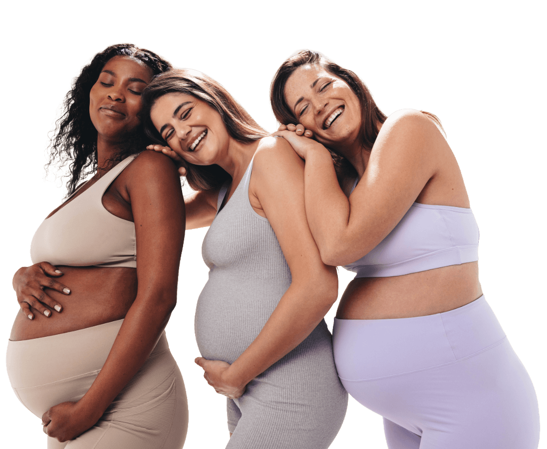 Three smiling pregnant women in sportswear